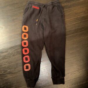 Overtime men’s small black jogger with orange Os